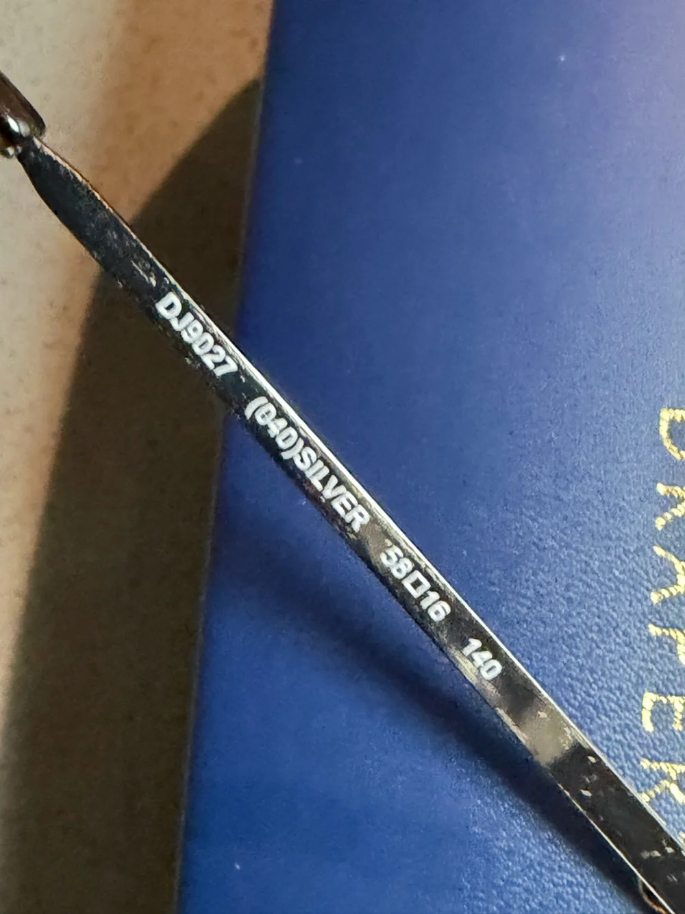 Draper James Silver-Tone Sunglass Arm with Navy Background